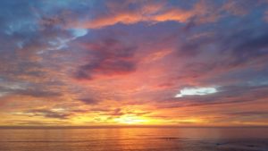 San Diego sunset, 12-mile run, Del Mar Civic Center, scenic route, Del Mar, Solana Beach, Cardiff by the Sea, Encinitas, nature's beauty, mesmerizing sunsets, California coastline.